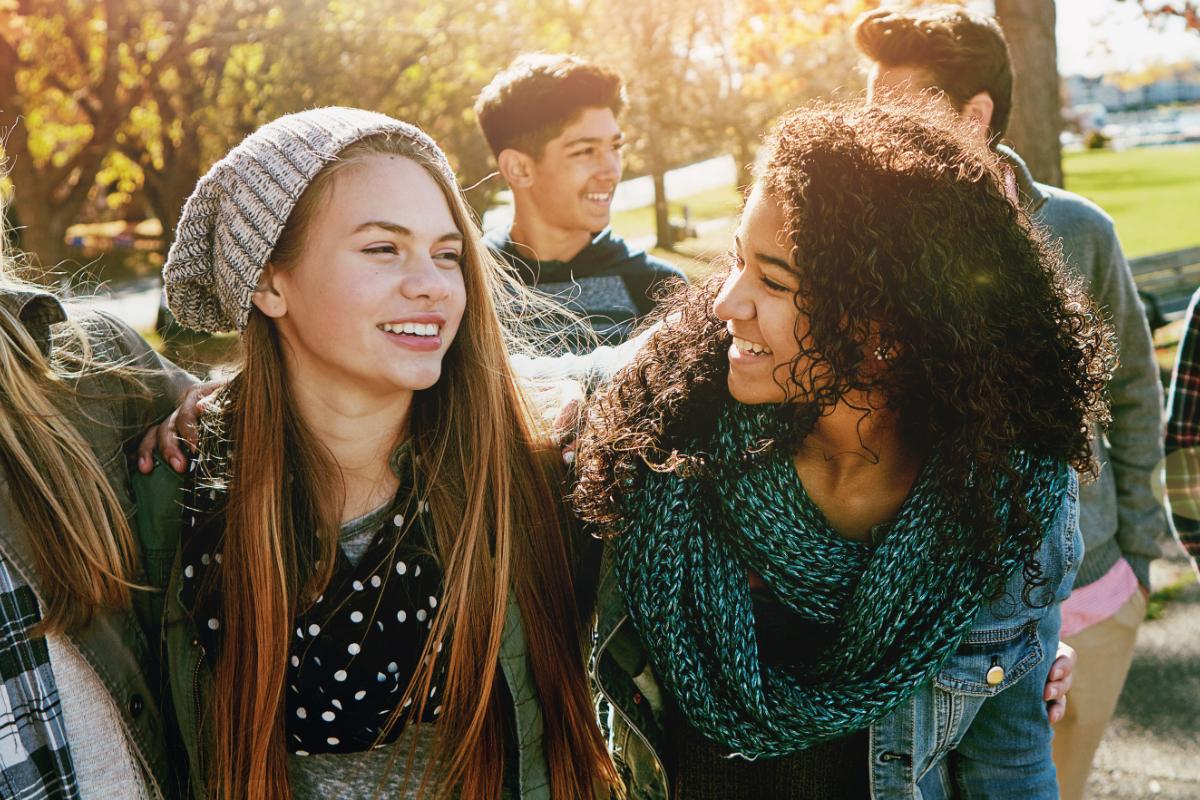 Teenagers talking after class