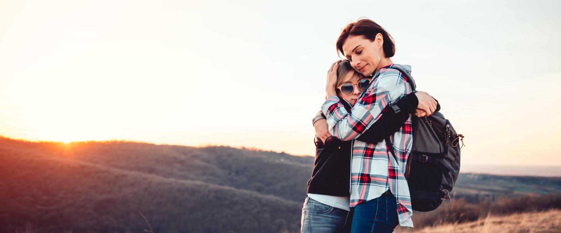 Teenager hugging mother